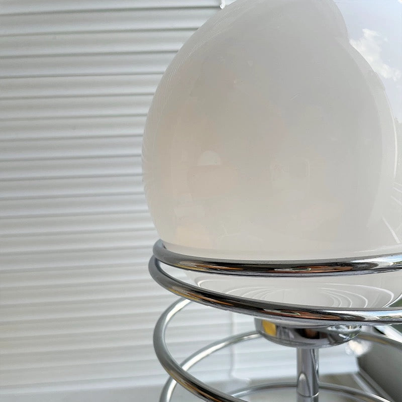 Close-up of the lamp's glass shade, emphasizing its elegant curvature