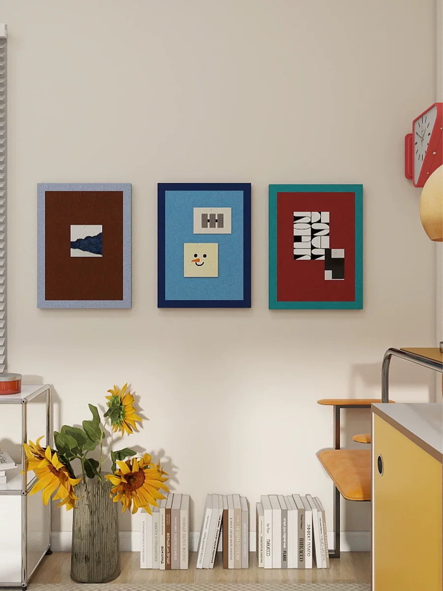 Three felt push pin boards arranged as a photo wall display above a colorful cabinet.