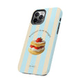 Phone case with a dessert illustration and text on a blue and beige striped background