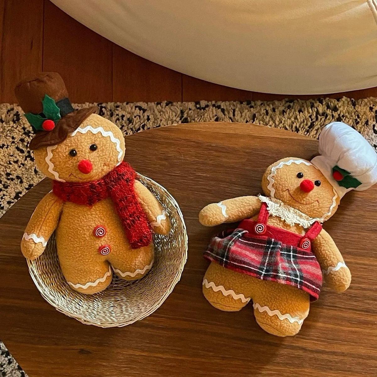 Gingerbread decorations show the man upright in a brown top hat and the woman reclining in her plaid skirt.