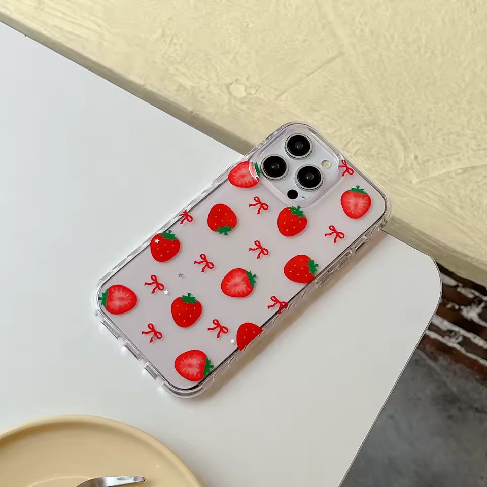 Phone case with strawberry design on a white surface