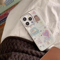 Phone case with cute illustrations on a white surface