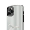 Phone case with striped pattern and bow design on a white background