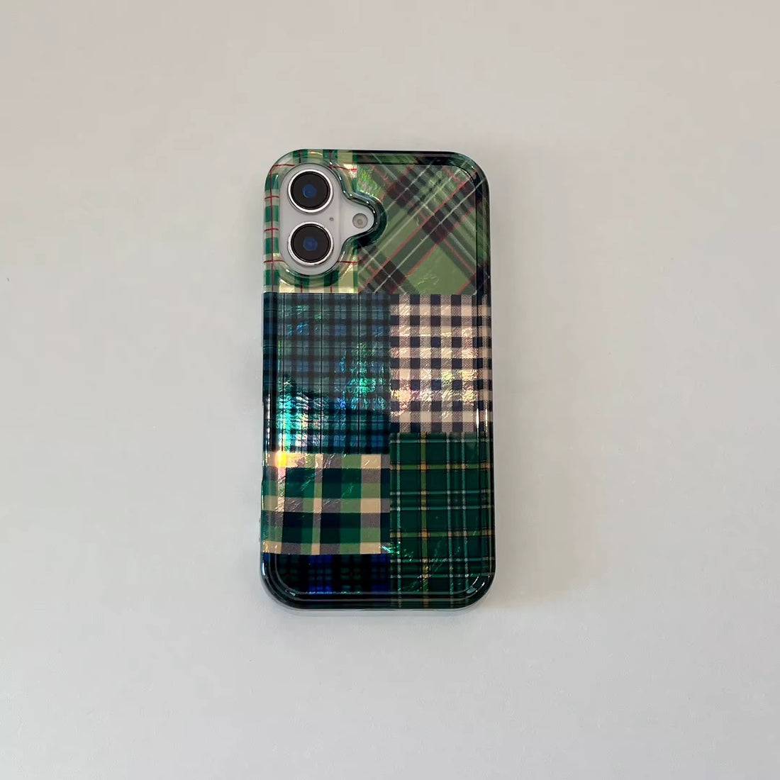 Forest green check iPhone case on leather chair
