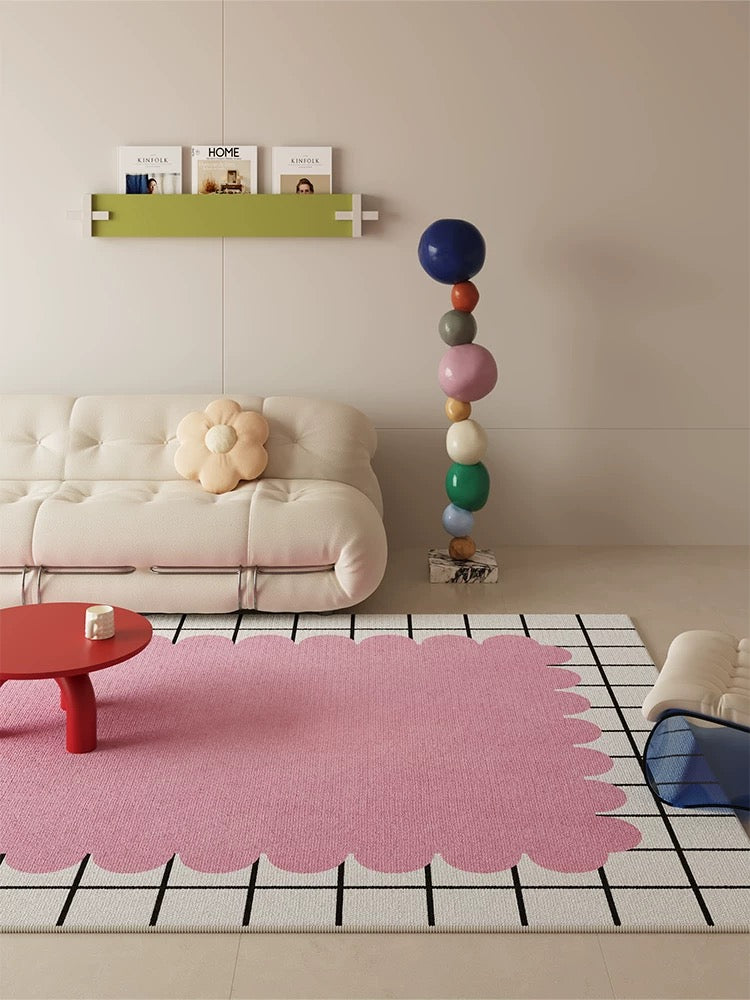 Living room with a pink rug, white sofa, and colorful balloons.