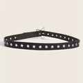 Black belt with star-shaped studs on a beige background