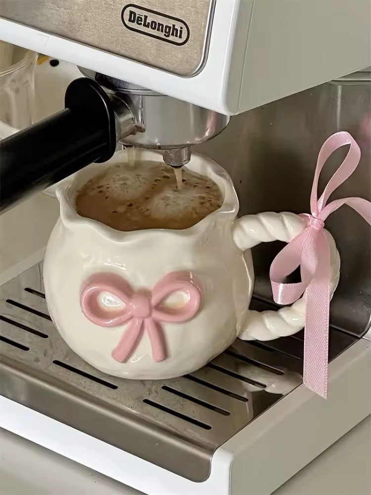 Handmade coquette ceramic mug with pink bow and irregular shape