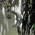 Hanging disco moon casting dreamy reflections