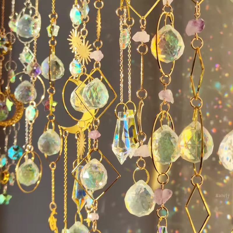 Rainbow-making sun catcher with moon and star design