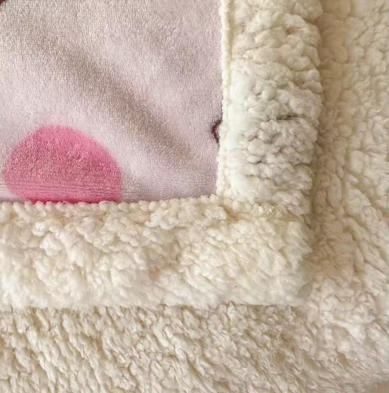 Sanrio blanket styled with pink desk and coquette aesthetic