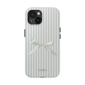 Phone case with striped design and bow detail on a white background