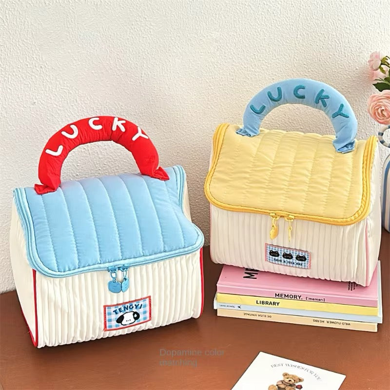 Adorable house-shaped makeup bag in kawaii cottagecore style with zipper and soft handle, ideal for skincare and toiletries