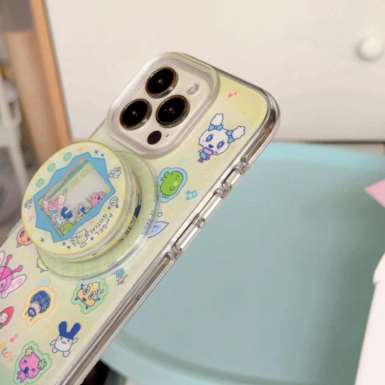 Phone case with cartoon designs on a phone