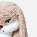 Side profile highlighting the plushie's soft texture and detailed stitching.