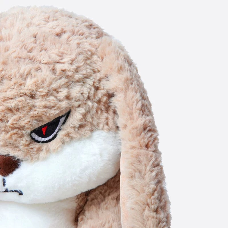 Side profile highlighting the plushie's soft texture and detailed stitching.