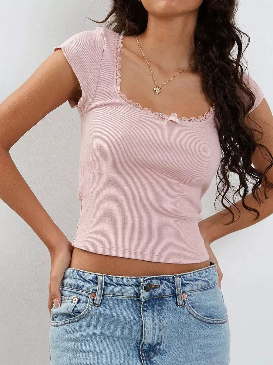 White milkmaid crop top with lace trim and fairycore vibe. Knitted Y2K baby tee for retro and cottagecore fashion.