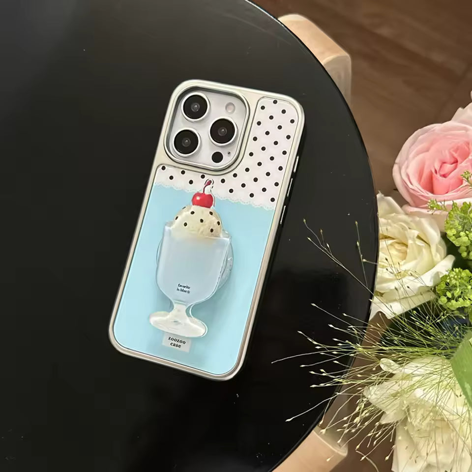 Phone case with ice cream design held over a box