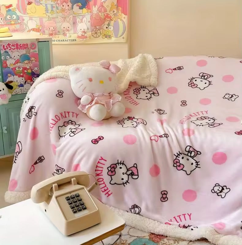 Close-up of pink reversible blanket with Sanrio Hello Kitty print.
