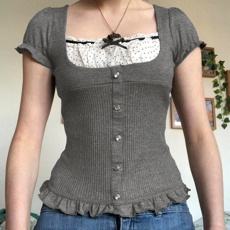 Kawaii Lolita style patchwork T-shirt with coquette ribbons. Gray knitted crop top with vintage-inspired puff sleeves and frill hem.