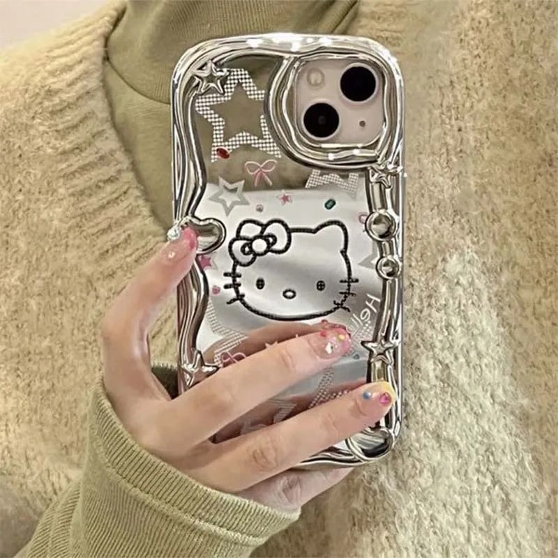 Y2K Hello Kitty iPhone case with silver mirror and rhinestones. Cute Sanrio design with anti-drop protection for iPhone 14, 13, 12, Pro Max.