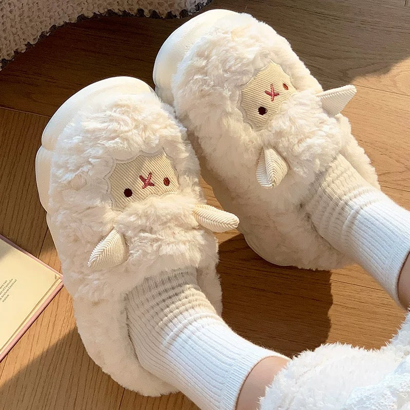 White fluffy slippers with cartoon face design worn indoors on a wooden floor.