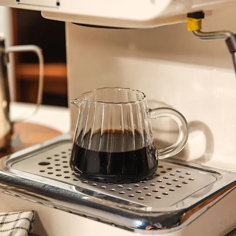 Stylish wavy glass cup with retro design. Perfect for breakfast milk, iced coffee, and cocktails in aesthetic kitchens.