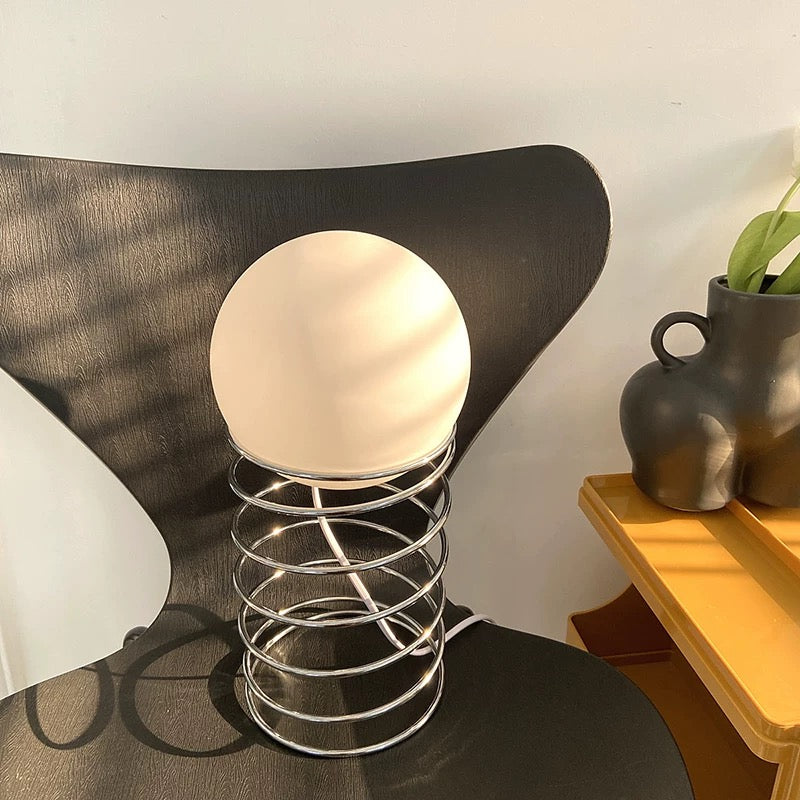 The lamp amidst Y2K-inspired room accessories, enhancing retro aesthetics