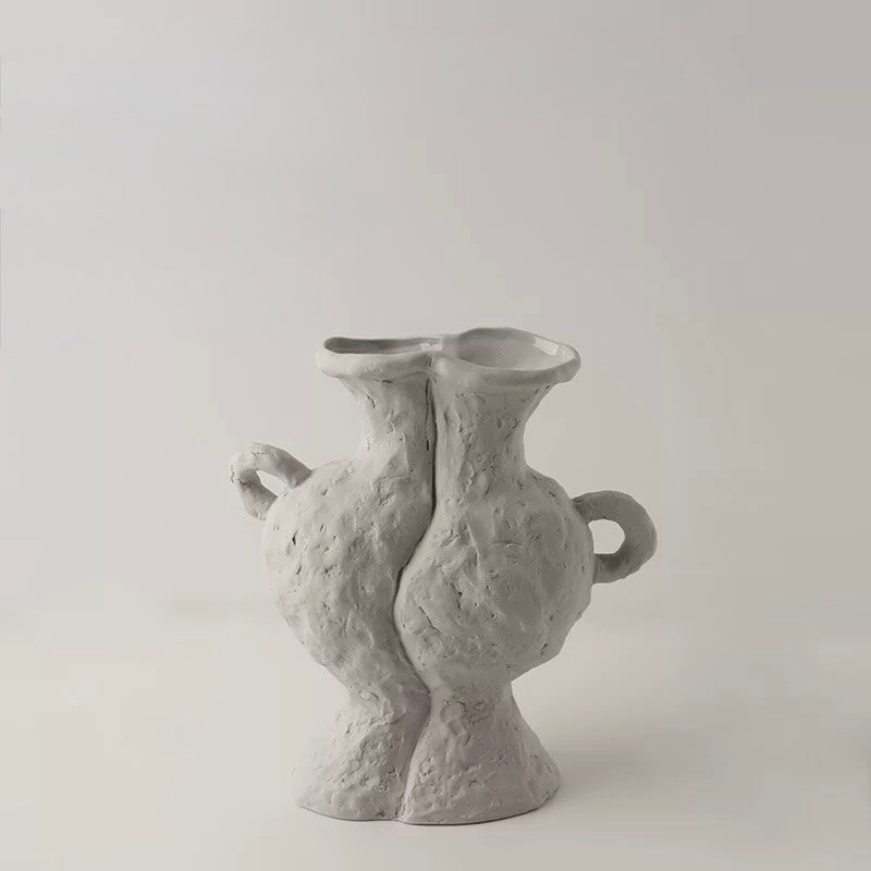 Two gray textured vases on a light gray background