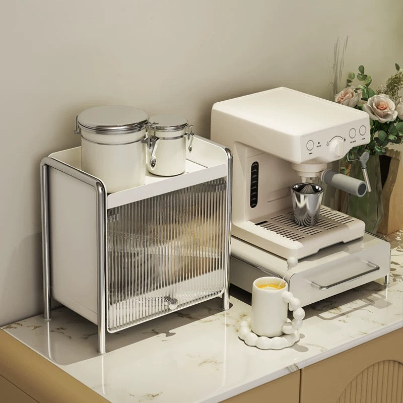 Minimalist coffee bar drawer stand used as a base for espresso machines, organizing capsules while saving precious countertop space.