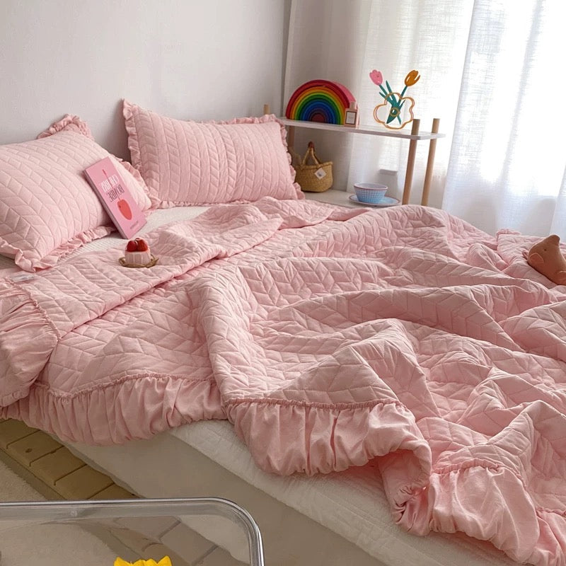 Minimalist ruffle bedding with stitched texture and soft edges