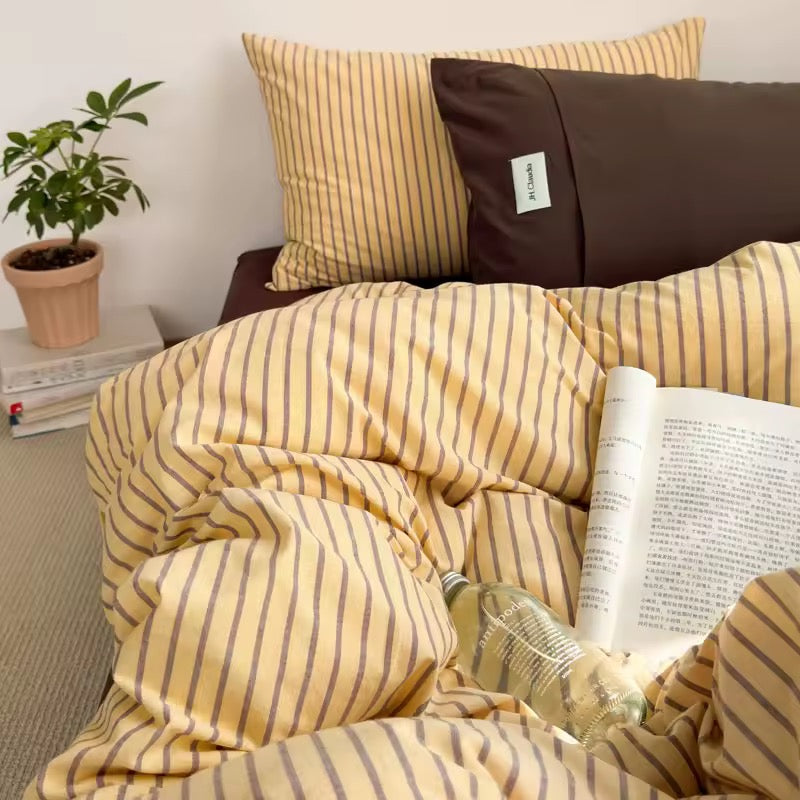 Minimalist yellow striped cotton bedding set for Scandinavian interiors.