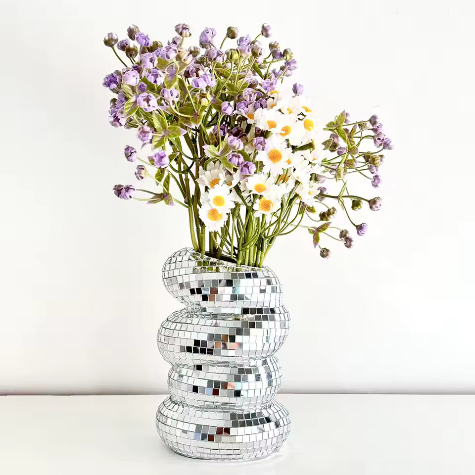 Silver mosaic vase with flowers on a white background