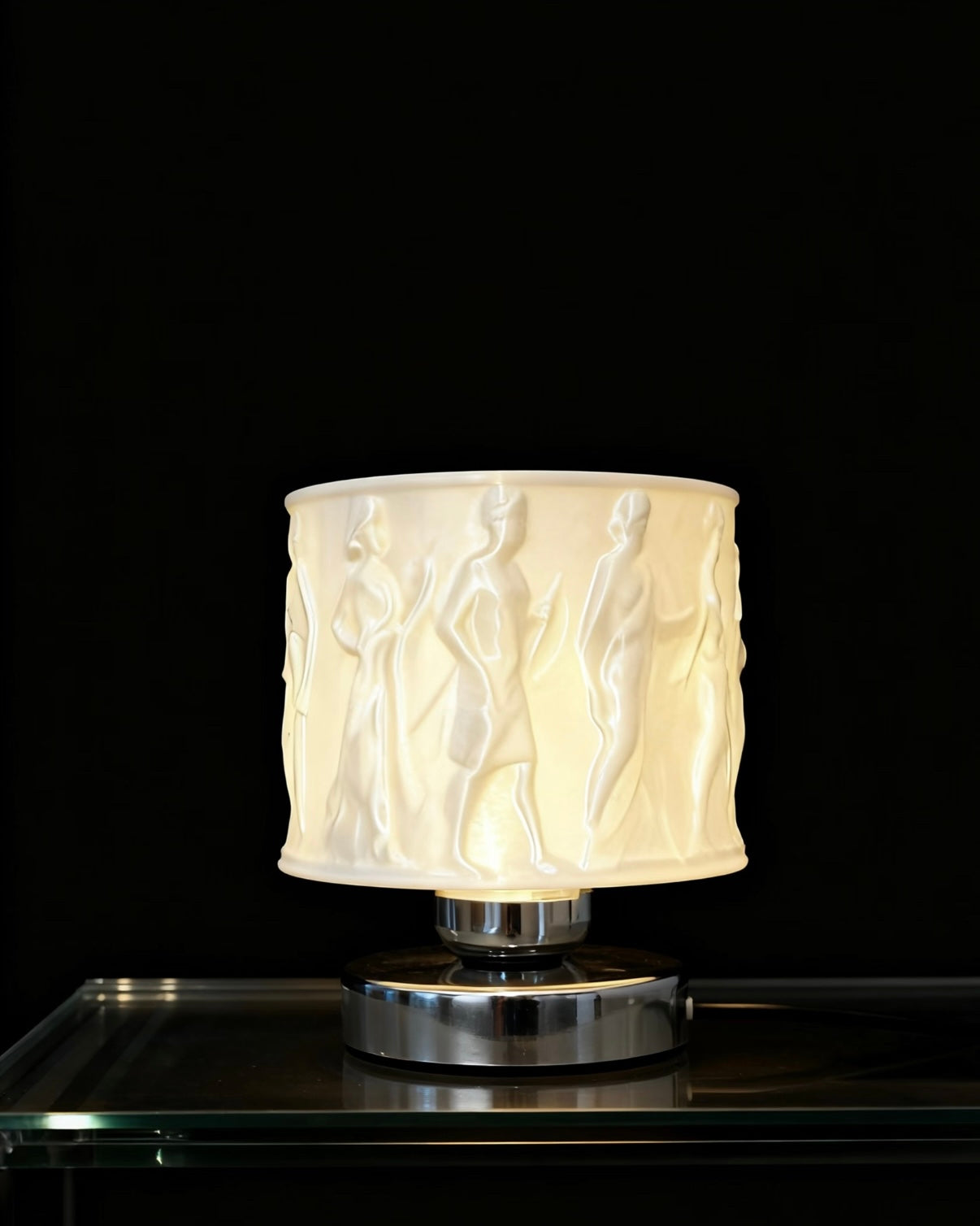 Modern relief art table lamp showcasing artistic texture and soft lighting in cozy bedroom
