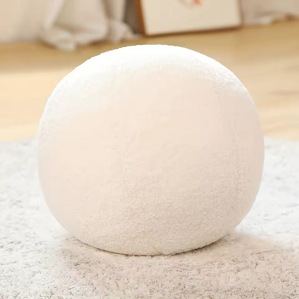 White spherical object on a light-colored surface