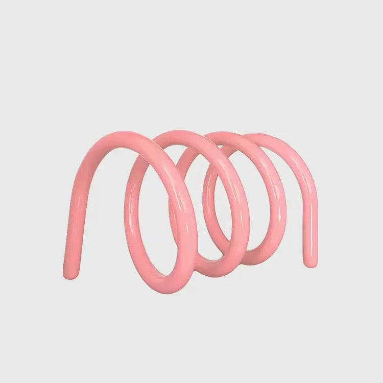 Compact metal desktop bookshelf organizing magazines and planners, styled for modern home office and small apartment spaces.