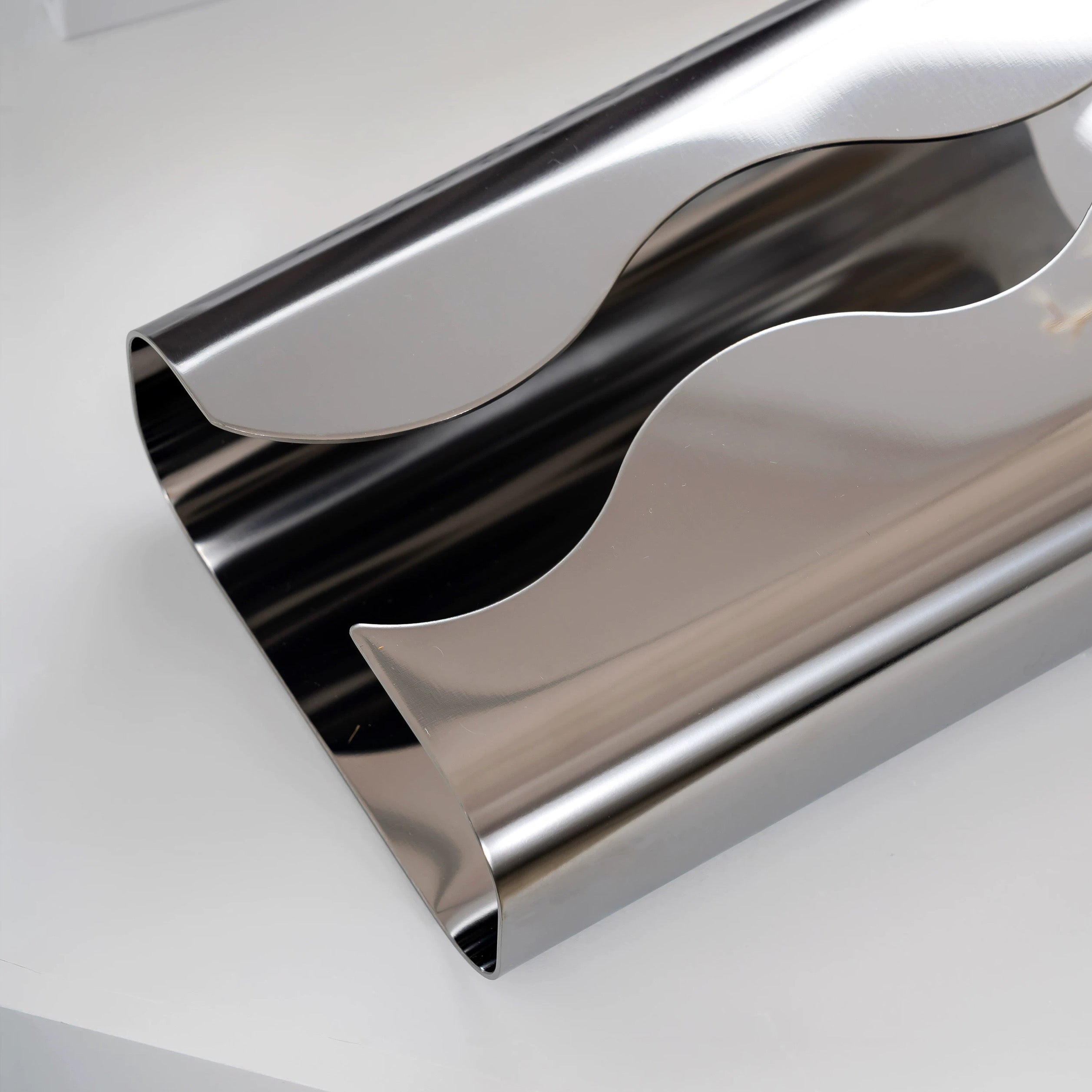 Close-up of a shiny metallic object on a white background