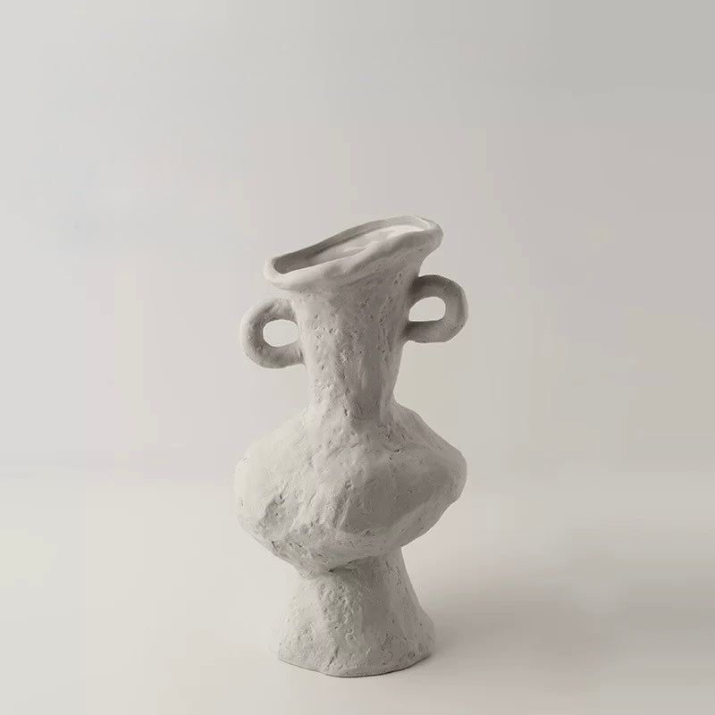 Gray ceramic vase with unique design on a light gray background