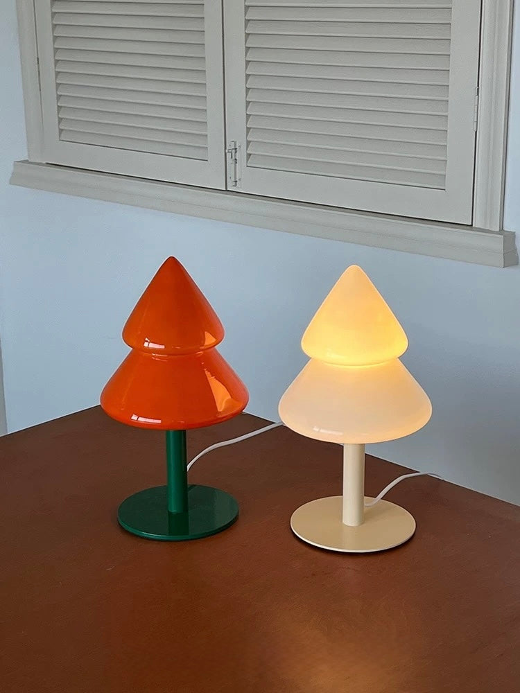 Orange and yellow Christmas tree lamps glowing in a bedroom setting