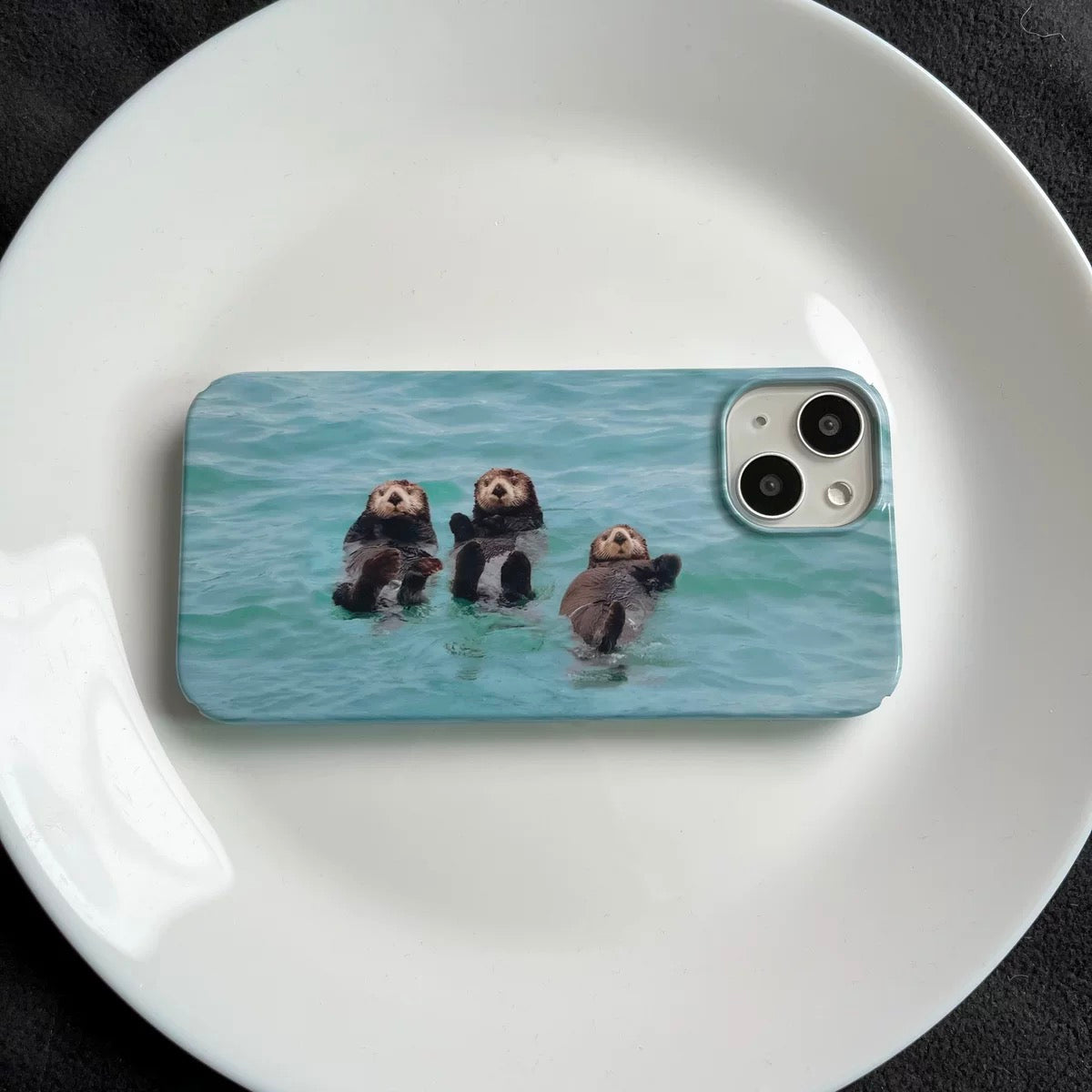 Wildlife otter case in blue, iPhone 12