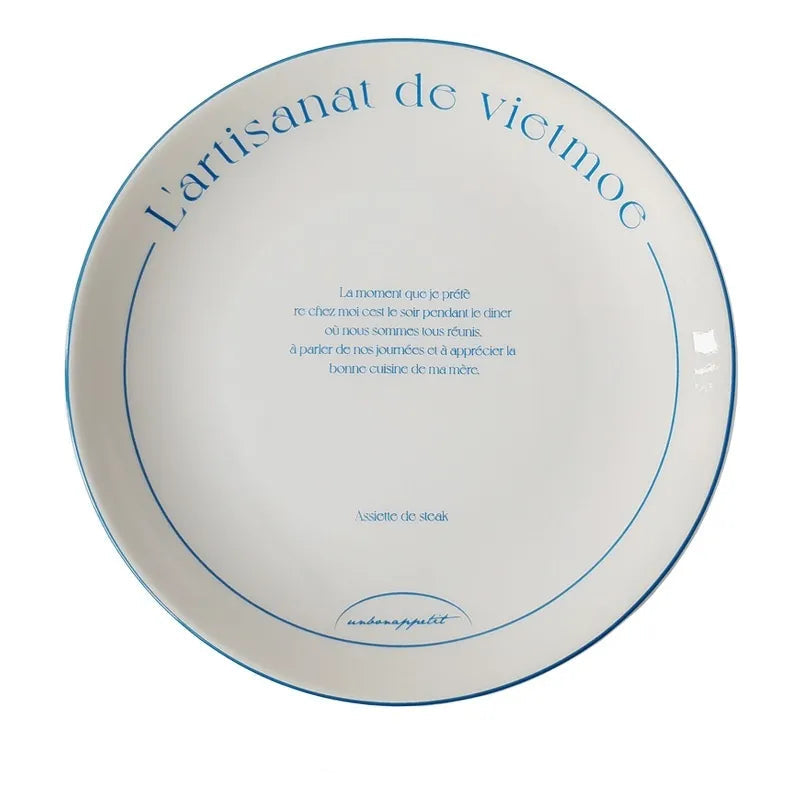 Oval French bistro ceramic dish with blue printed wording and measurements shown underneath the plate