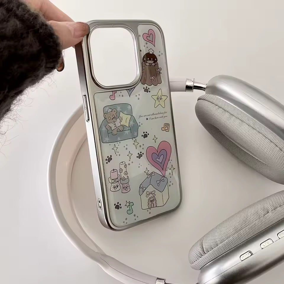 Phone case with cute illustrations held by a person, with books and a plant in the background.