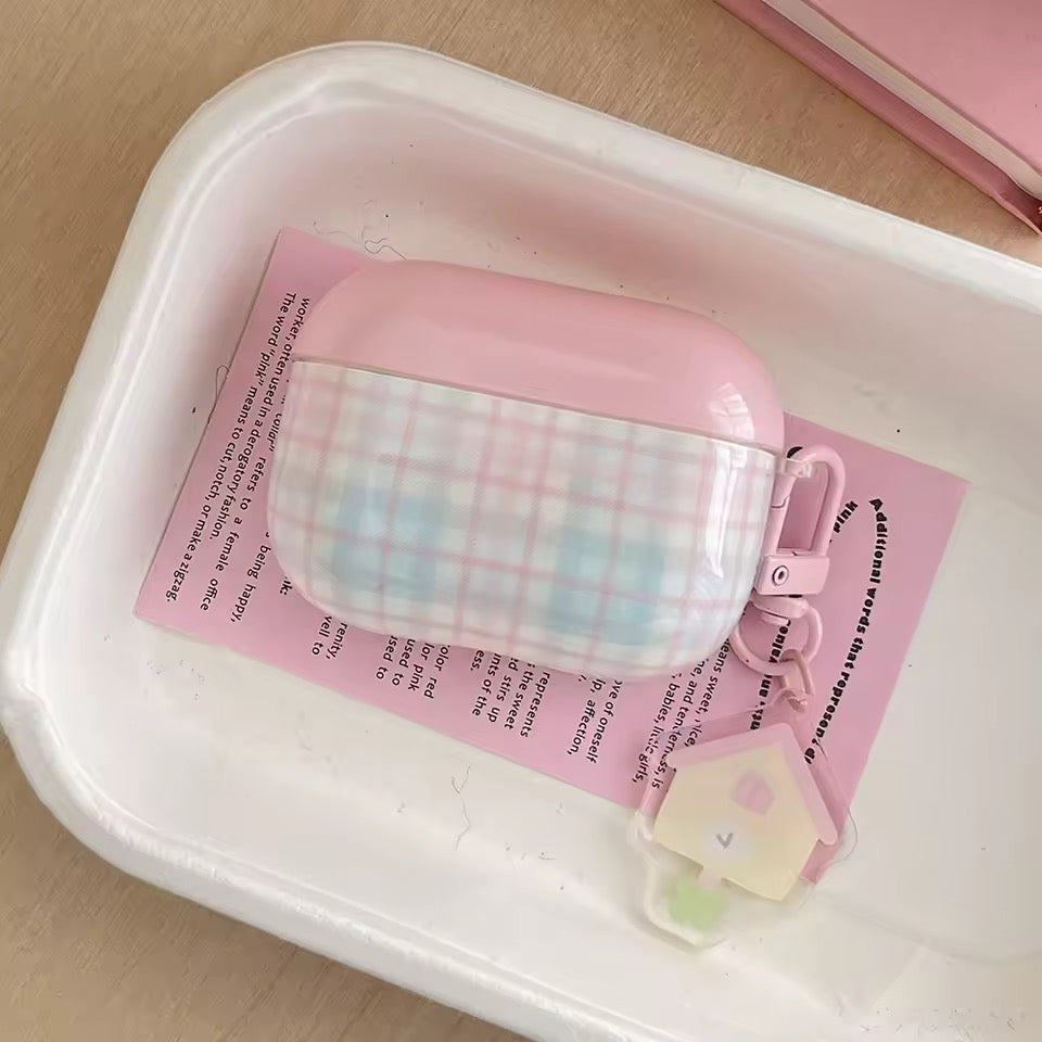 Pink and white checkered product on a pink paper with text, inside a white container.