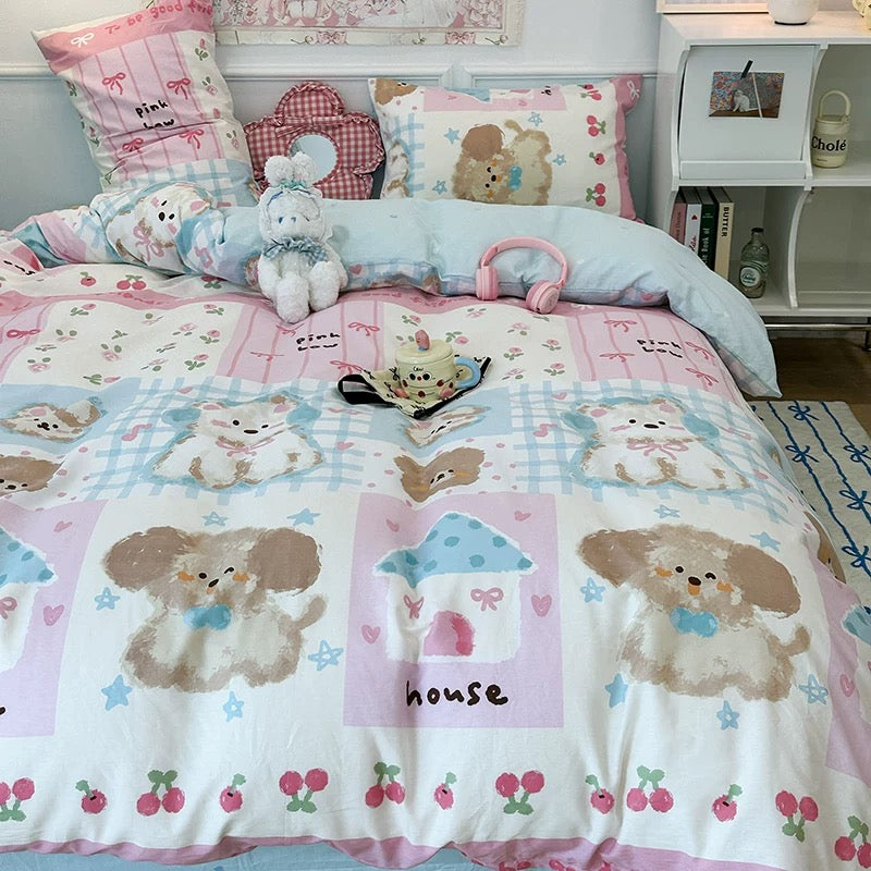 Side angle of the bed highlighting the pastel colors and puppy motifs.