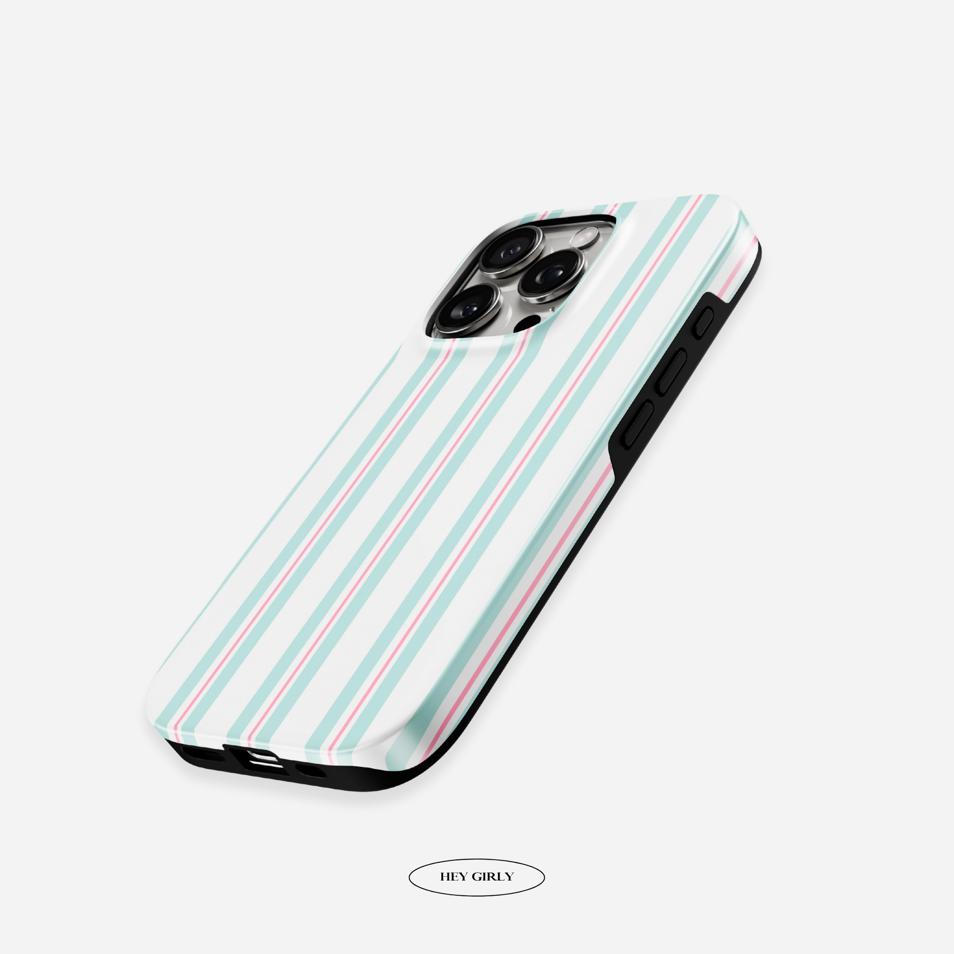 The Hey Girly x The Feelz striped case resting on a pastel blanket, adding soft Korean‑minimalist vibes.