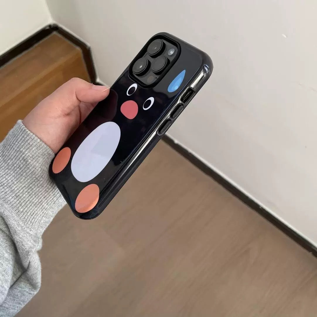 Phone case with a cartoon penguin design held by a person