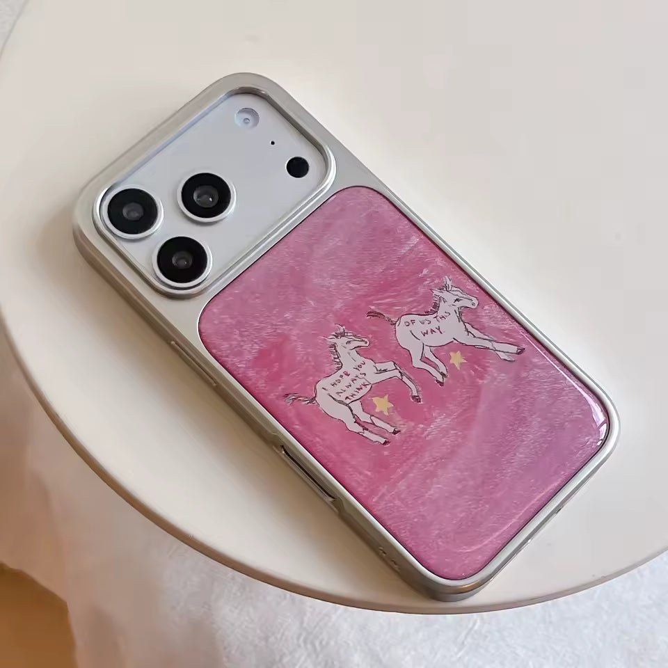 Soft pink phone cover featuring illustrated ponies creates charming everyday accessory for artistic fashion enthusiasts everywhere today