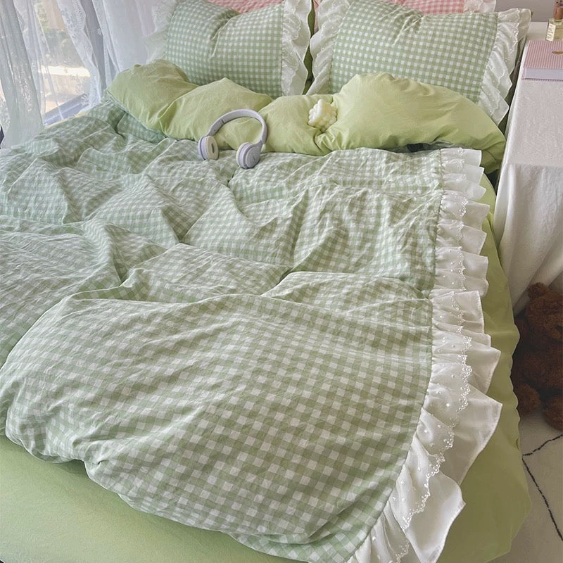 All three pastel gingham bedding options styled together: pink, green, and blue
