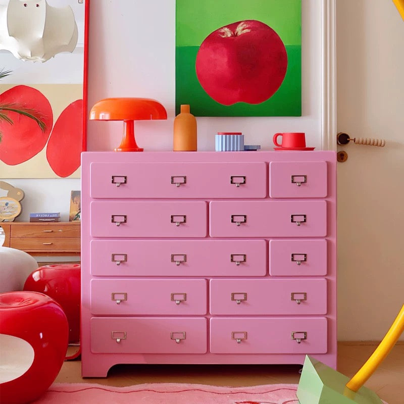 Dopamine pink drawer cabinet placed in entryway for cute organized storage solution