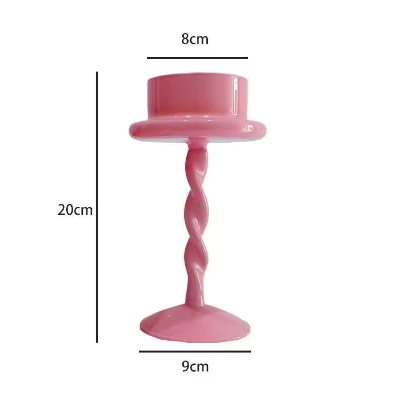 Pink candle holder with dimensions labeled on a white background