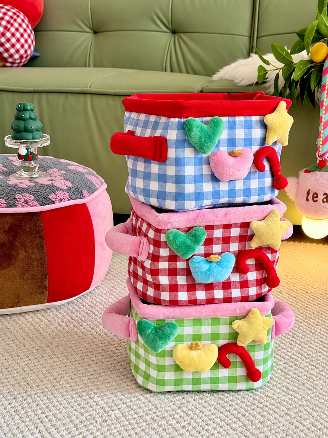 Plush gingham storage baskets stacked in blue, green, and red plaid